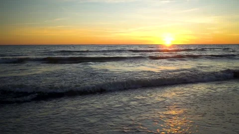 View of dramatic sea sunset. Golden sky and waves at the Baltic seaside 스톡 동영상 277615903