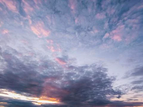 View of the dramatic sky with dark cumulus clouds at sunset. Landscape concep Stock Photos
