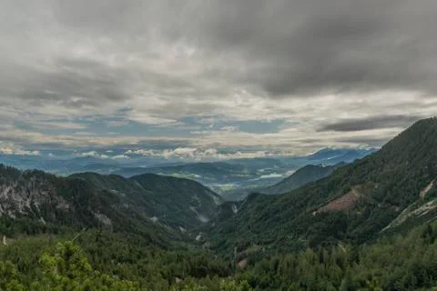 View on Drau river valley from path to Mittagskogel hill in cloudy summer day Stock Photos