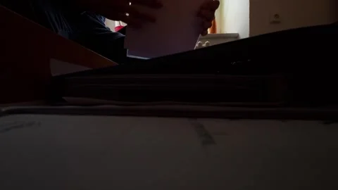 View from a drawer being opened by a man searching for documents. Office work Stock Footage 322182414