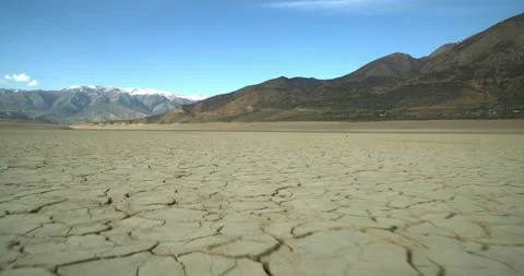 View of a dried-up lake or river in a mountainous area due to an environmental Stock Footage 132054604
