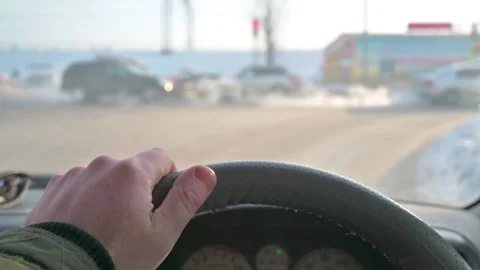 A view of the driver hand on the steering wheel of a car in slow motion Stock Footage 160867039