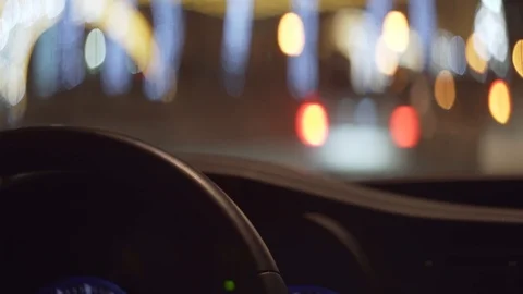 View from driver seat of the car on blurry stop signals of cars Video stock 121314570