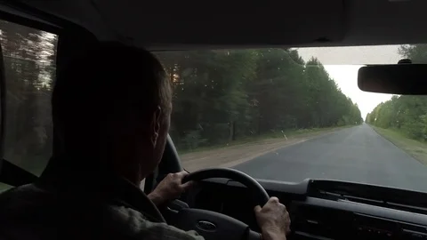 View of the driver, who drives old car on a bad road in the middle of the forest 스톡 동영상 79215860