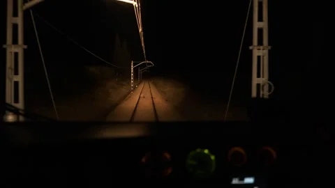 View from the driver's cab of an electric train, a night voyage Stock Footage 260055056