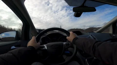 View from the driver's eyes to the steering wheel and the road. Safe driving Stock-Footage 336268248
