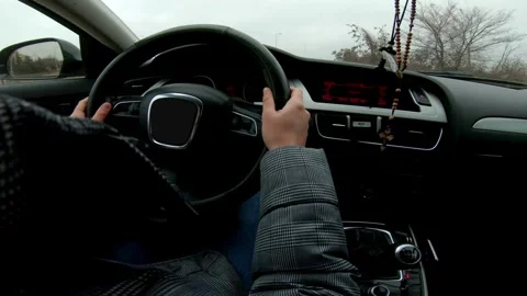 View from the driver's eyes to the steering wheel and the road. Safe driving Stock-Footage 336268804