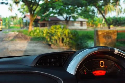 A view from the driver's seat looking out at a rural road through the winds.. Stock Photos
