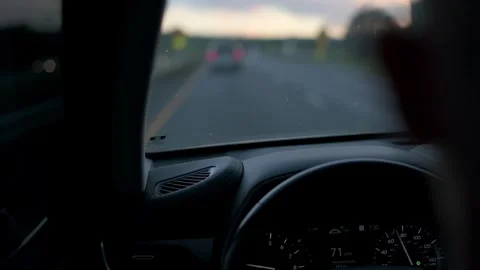 View from drivers seat showcasing speedometer and blurred highway scene ahead Stock Footage 293122340