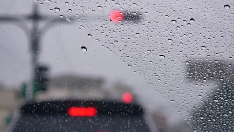 View from the drivers seat to the windshield at heavy raining day Stock Footage 82634748