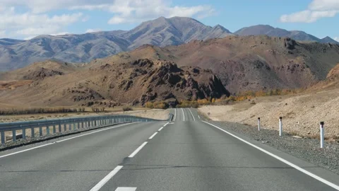 View From Driving Car On Highway Going To Hilly Mountains Stock Footage 228052264