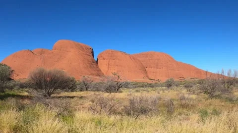 View from driving car of red domed rock formations Kata Tjuta, Australia Video stock 278107115