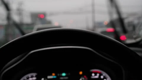 View of driving in the rain from inside the car and the wipers working. Stock Footage 174086575
