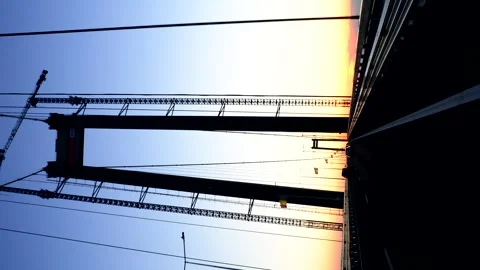 View from driving on a suspension bridge in the sunset light Stock Footage 256076929