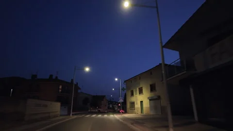 View of driving through the residential streets of Spain at night. Stock Footage 320855342