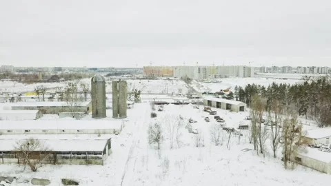 View from a drone to an abandoned, snow-covered vehicle fleet of technical Stock Footage 145255007