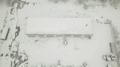 View from a drone to an abandoned, snow-covered vehicle fleet of technical Stock Footage 145301042