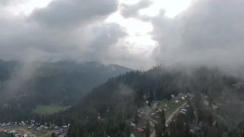 View from drone above clouds of mountain village of Bakhmaro. Stock Footage 236921486