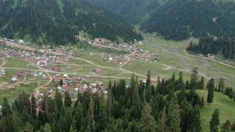View from drone above clouds of mountain village of Bakhmaro Stock Footage 236921525