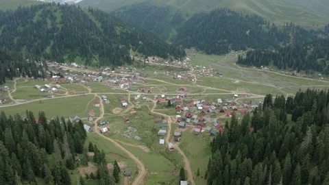 View from drone above clouds of mountain village of Bakhmaro Stock Footage 236921596