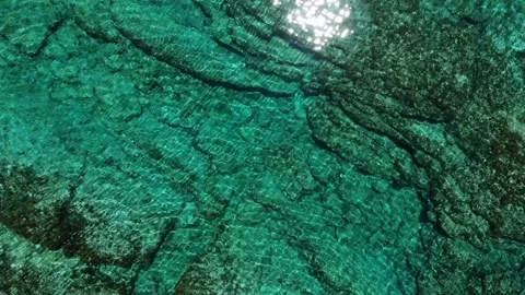 View from drone to azure water. Clear water from above. Stones under water Stock Footage 130205647