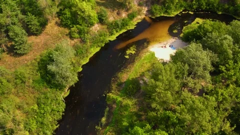 View from a drone, camera takeoff over the forest and the Orel River. Video stock 180970640