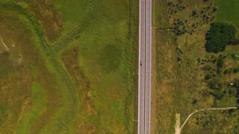 View from a drone, The car carries an inflatable motor boat along the track Stock Footage 180962980