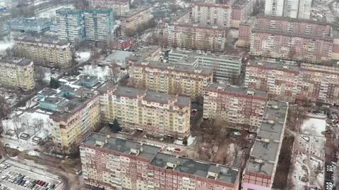 View from drone on city rooftops patio. Winter cityscape background. Stock Footage 130386813
