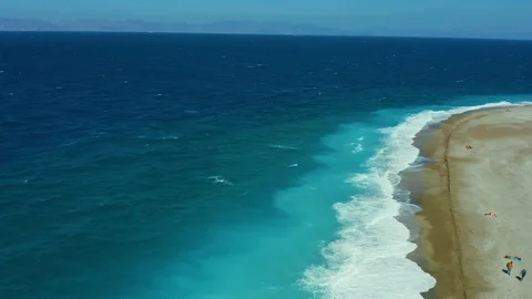 View from the drone on Elli beach Rhodes Greece, sand, waves, surf, vacationers Stock-Footage 118921199