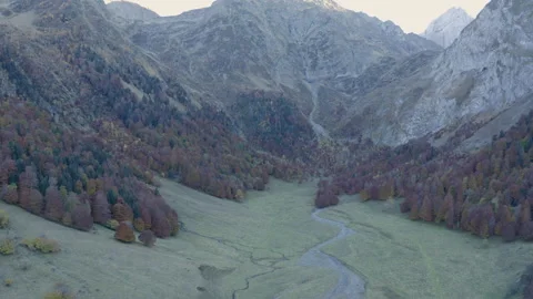 View of drone flying away from the mountains with trees and their colors Stock Footage 173227145