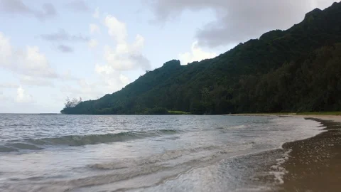 View from drone flying close ocean surface, approaching to tropical forest Video stock 126612101