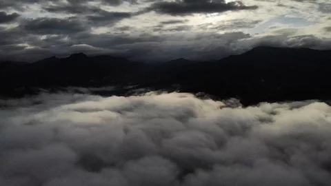 View from a drone flying over a cloud in the morning With the mountainous env Stock Footage 116037333