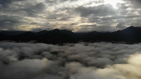 View from a drone flying over a cloud in the morning With the mountainous env Video stock 118758674