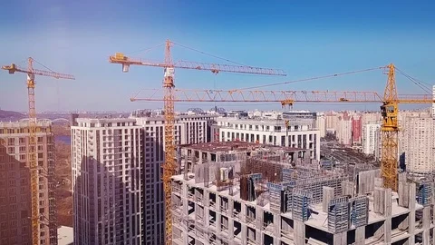 View from the drone going down on a house under construction and builders Stock Footage 126181312