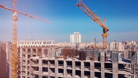 View from the drone going down on a house under construction and builders Stock Footage 126181396