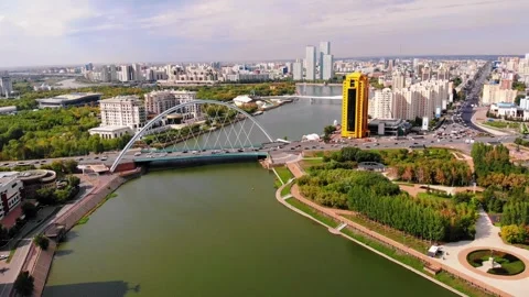 View from a drone of the Ishim River in Astana, a bridge across the river. Stock Footage 249952097