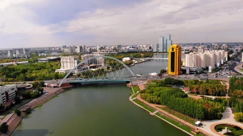 View from a drone of the Ishim River in Astana, a bridge across the river. Stock Footage 249952176