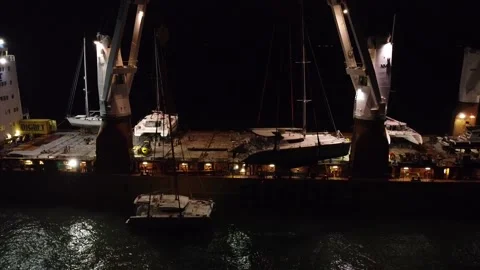 View from a drone to the night loading of an international ship Stock Footage 158316599