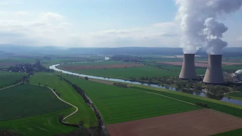 View of drone of nuclear power plant and river Stockbeeldmateriaal 153281803