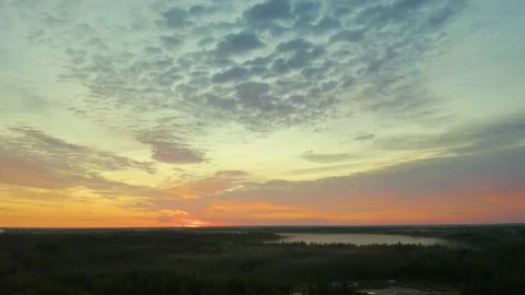 View from a drone on Orange sunset sky over Suur Strait. Nordic white night Stock Footage 134947642