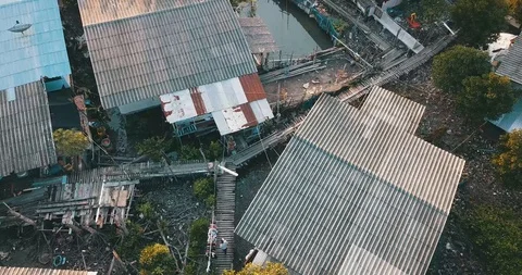 View from the drone of a person walking through the asian village Video stock 122056556