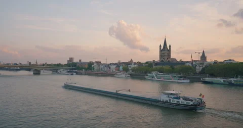 View from a drone of the Rhine in the city of Cologne, Germany. A cargo ship Stock Footage 250174552