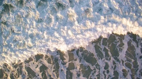 View from a drone that rises above the sea. Rough texture of the moving spume. Stock Footage 85037312