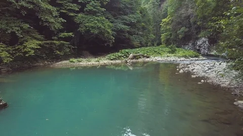 View from drone river pool with blue water. Water stream of river in forest Video stock 94562277