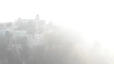 View from drone of scary castle hidden in thick, white fog. Magic video. Stock Footage 148092839
