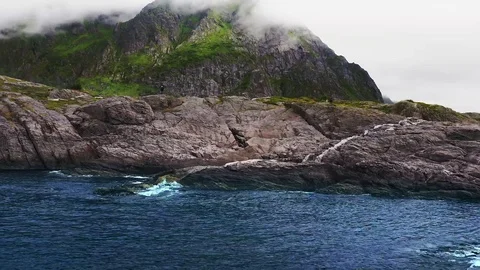 View from the drone of the sea and mountain with a fishing village Stock Footage 122705690