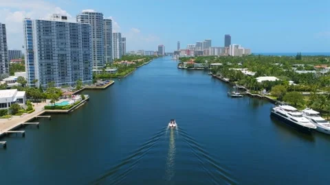 View from drone on single boat sailing in water channel between glassy Stock Footage 249491988