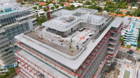 View from drone on summer terrace on construction site of new multi-storey hotel Stock-Footage 245955428