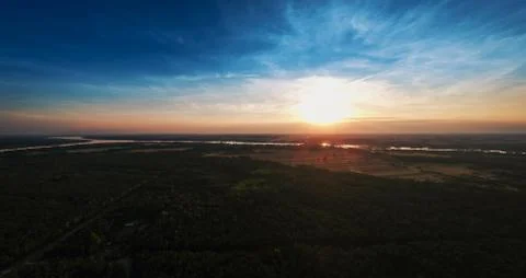 View from the drone at sunset over the forest Stock Photos