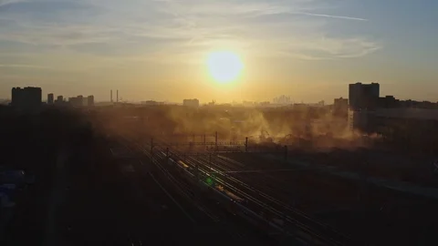View from a drone on a train moving through the industrial zone, on a multi-t Stock Footage 127131577